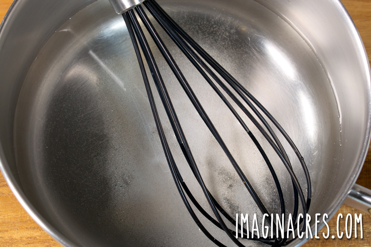 Overhead view of pickling liquid in a pot.